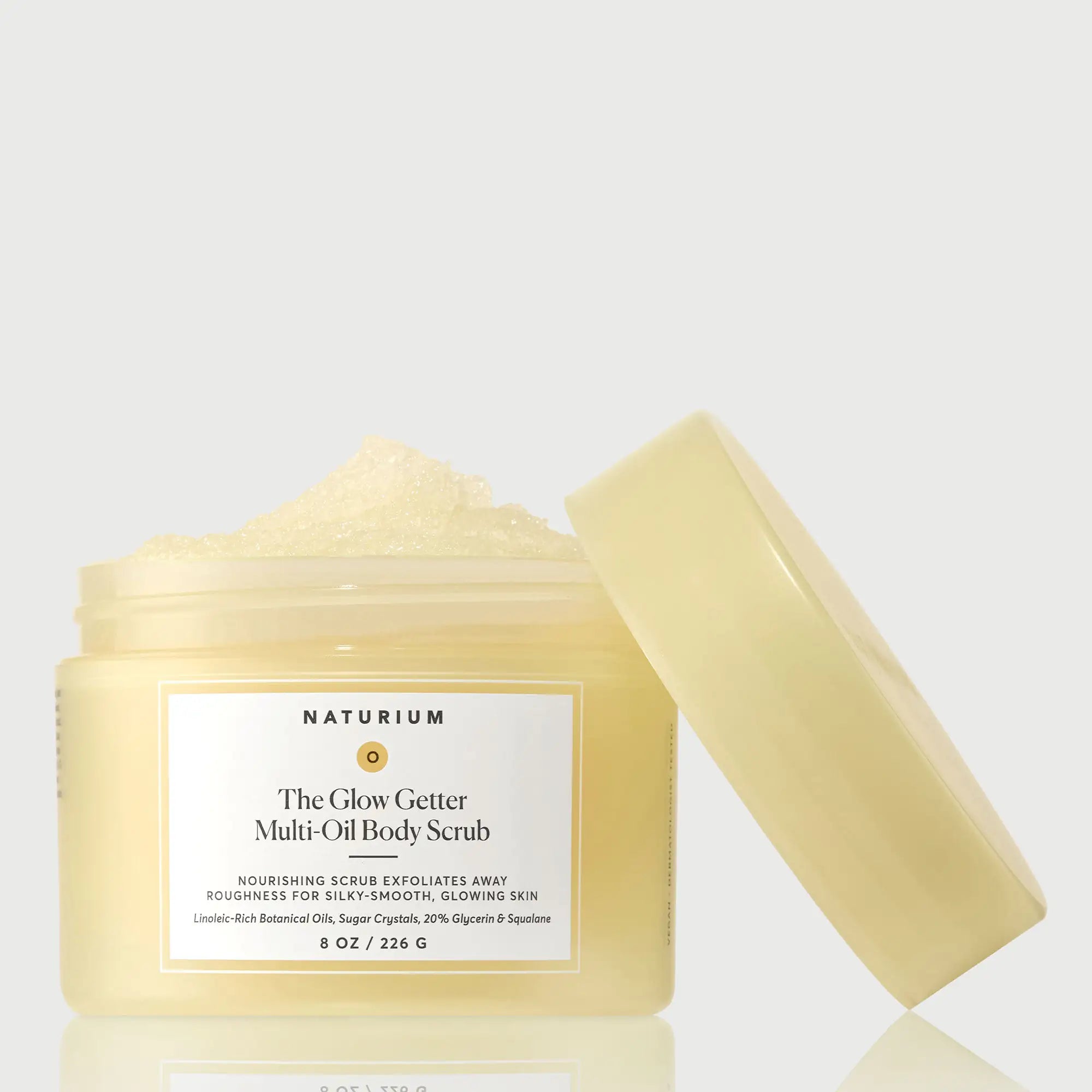 the-glow-getter-multi-oil-body-scrub-a5 NATR-40028-GlowGetter-Multi-Oil-Body-Scrub-Front-CapOff-bonebkgd.webp